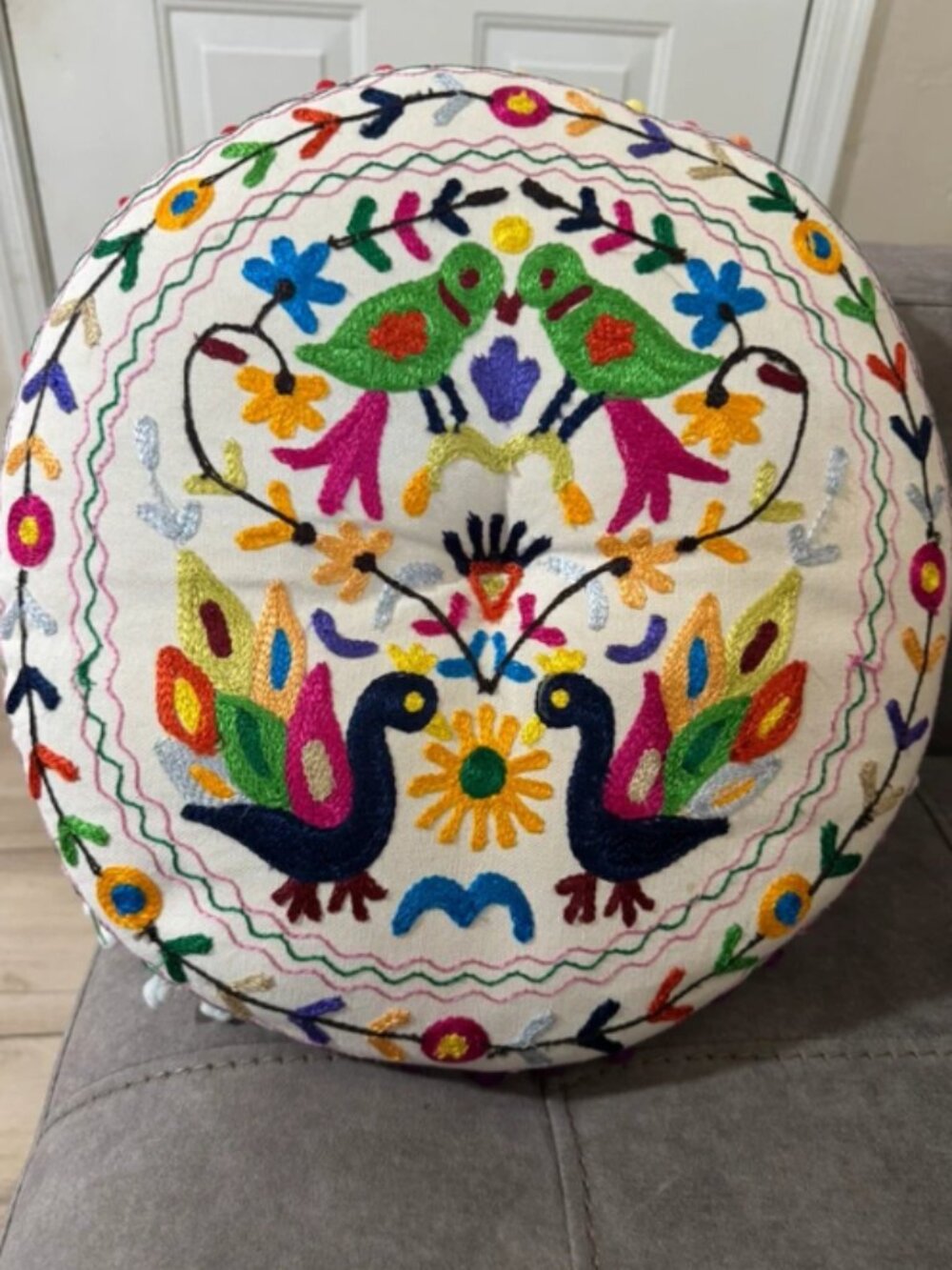 Embroidered round decorative pillow